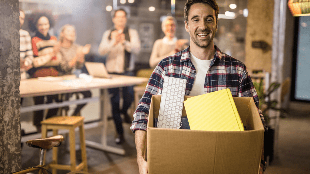 man happily quitting job